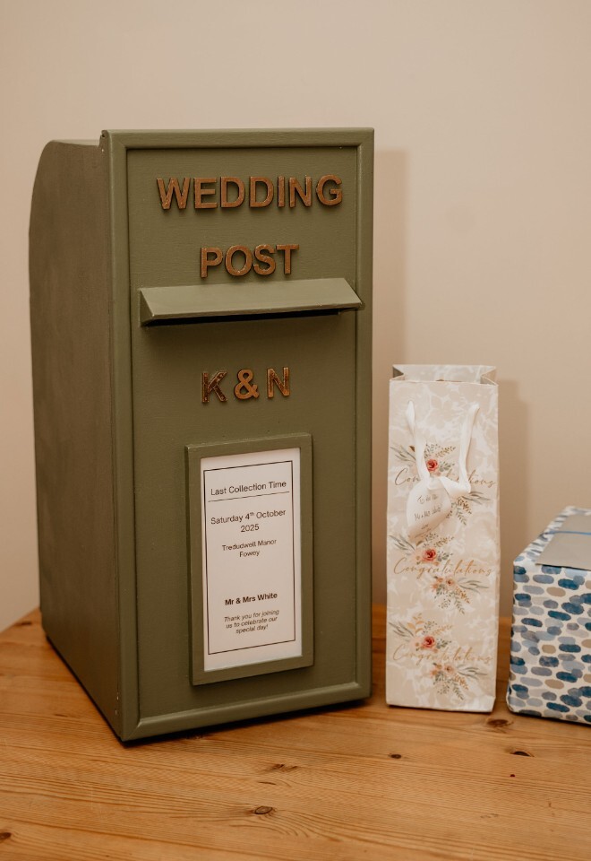 Wedding post box with couple’s initials and collection details.