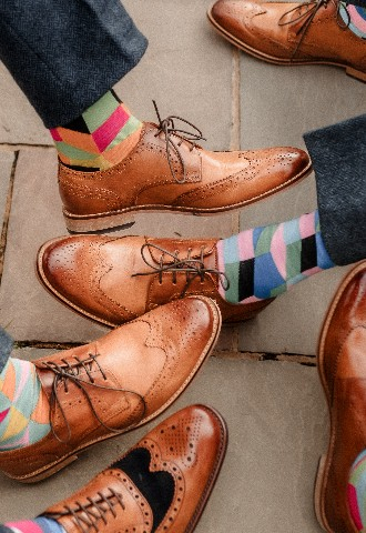 Groomsmen funky colourful socks at Southdowns Manor West Sussex