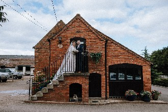 Bride and groom on steps at alcott weddings