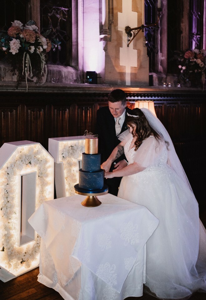 couple cutting wedding cake