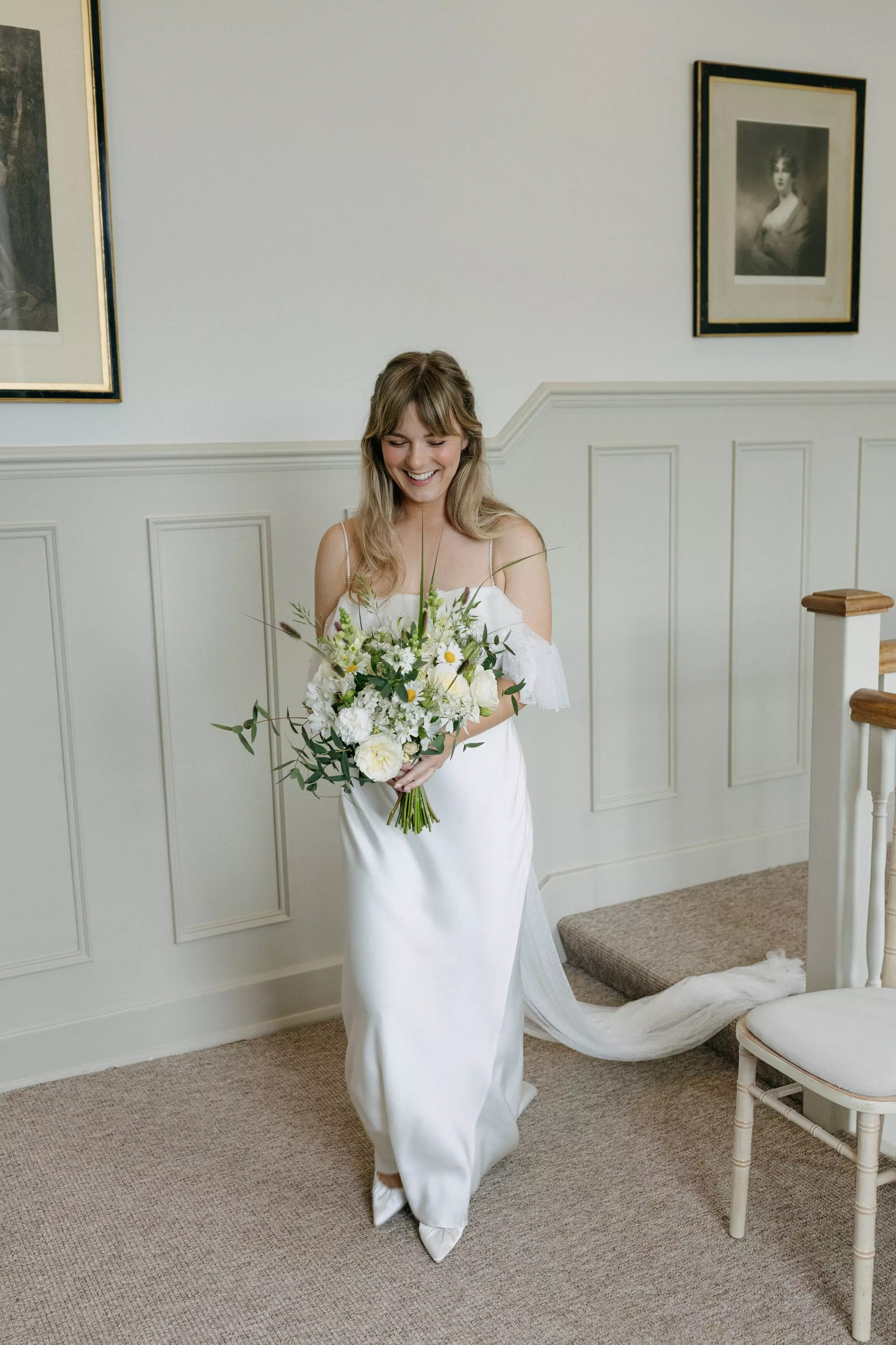 Bride holding a hand tied wedding bouquet