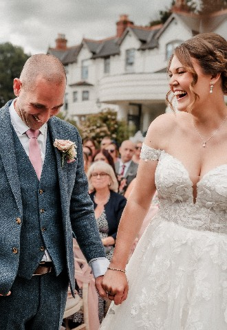Wedding couple meeting at end of the aisle at Southdowns Manor West Sussex