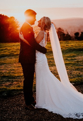 Bride and groom sunset photo at Hedsor House wedding venue