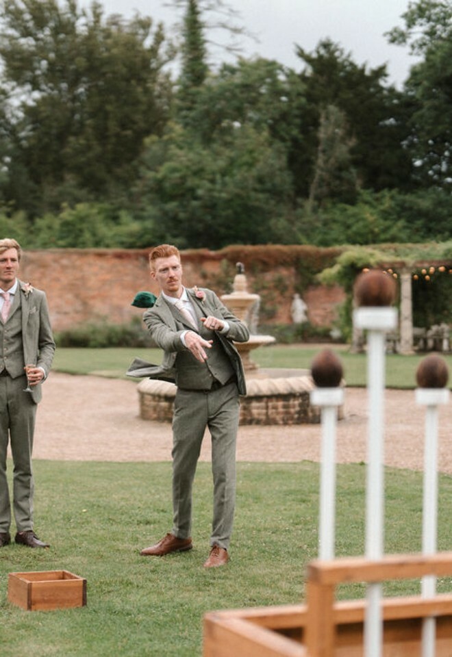 Guests enjoy lawn games at Elmhay Park wedding