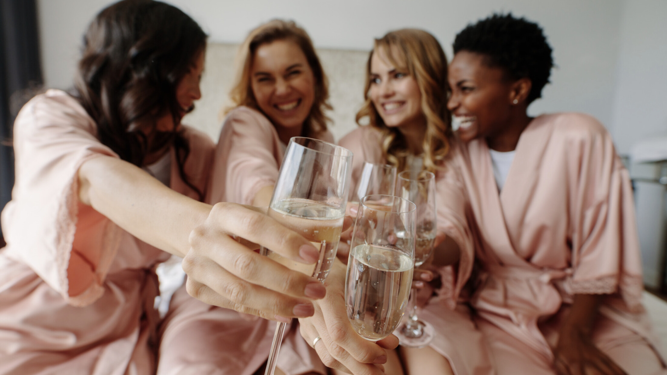 Bridal party in pink with Prosecco 