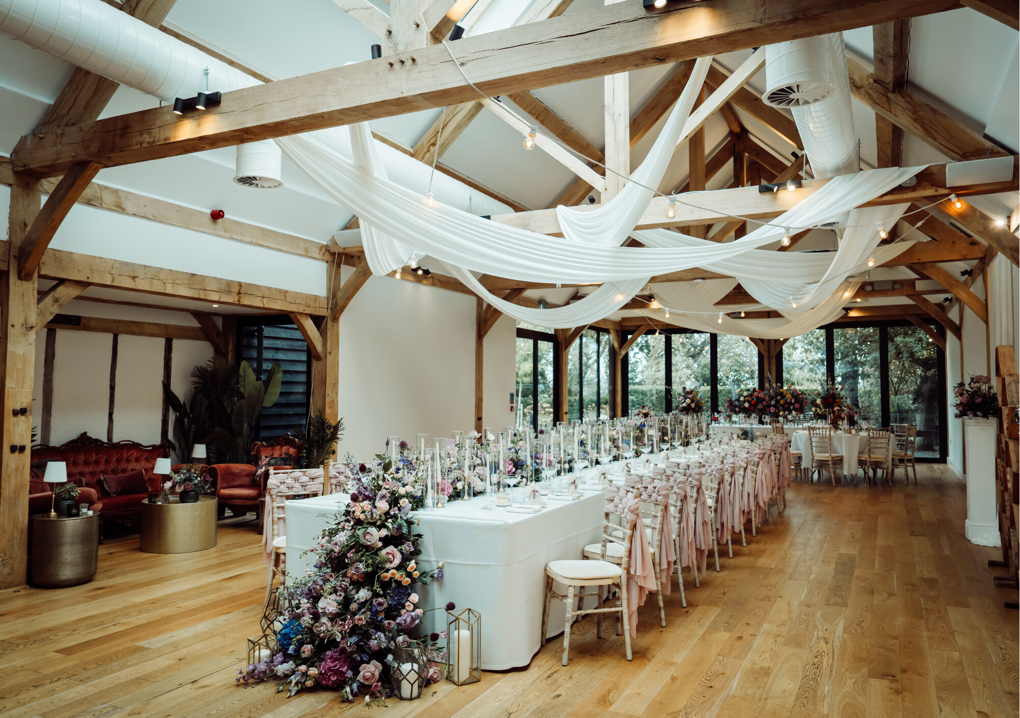 Wedding reception set up in The Woodland Barn at Alfriston Gardens