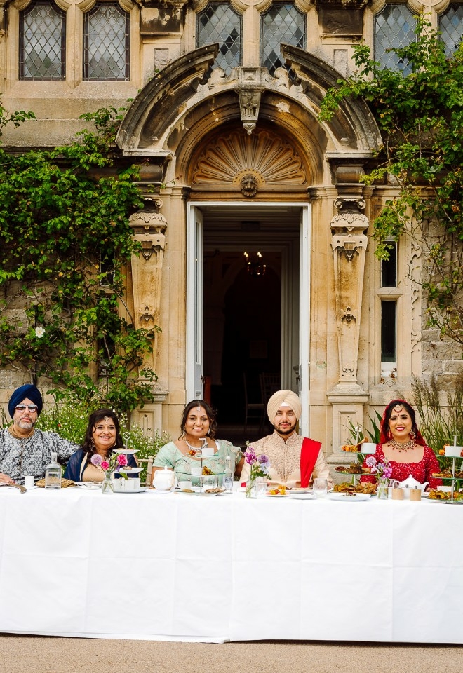 Couple sitting with family members and relatives