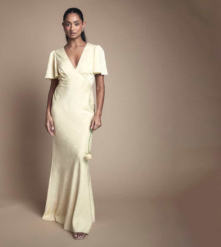 Butter yellow satin jacquard bridesmaid maxi dress with angel sleeves for a spring wedding