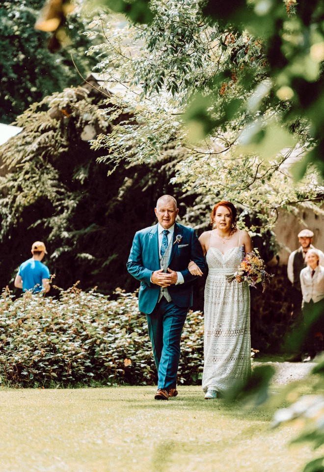 Father walking bride down the aisle