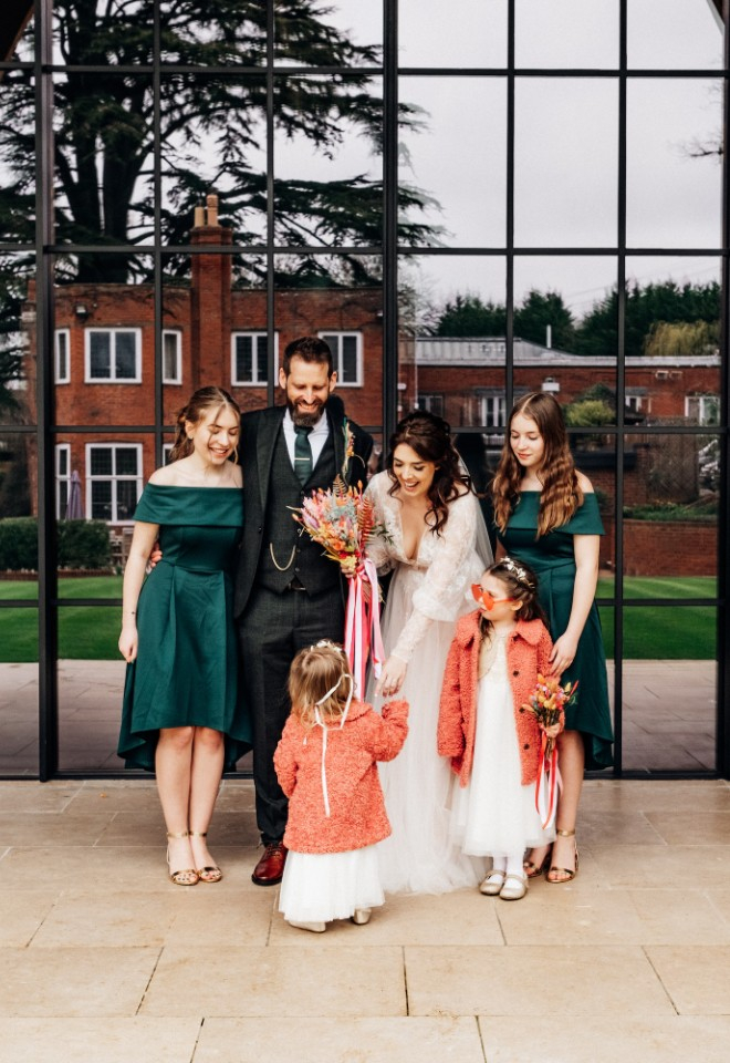 Family photo with bride and groom