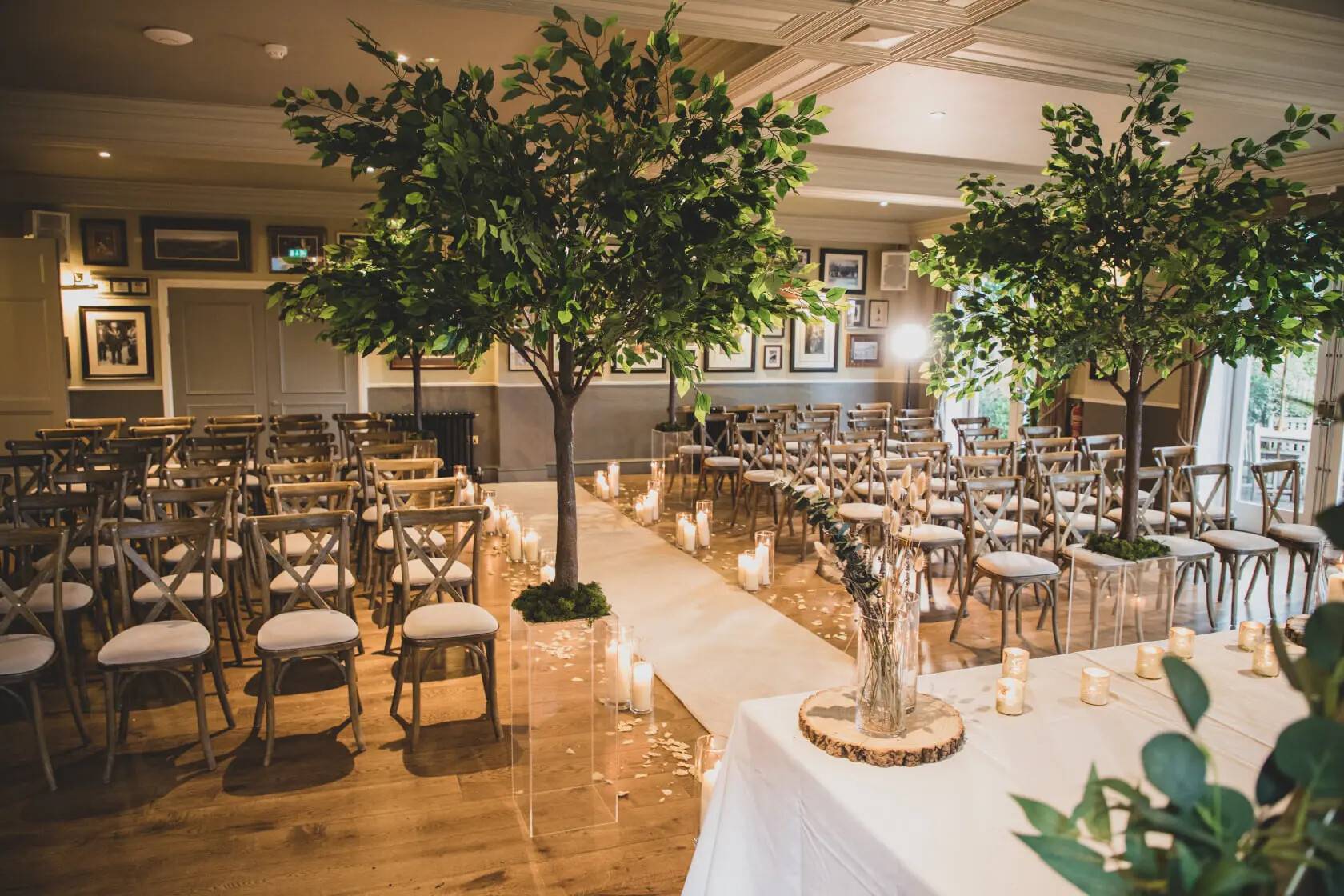 Wedding ceremony set up with chairs, candles and faux trees at The Little Fox, Merseyside
