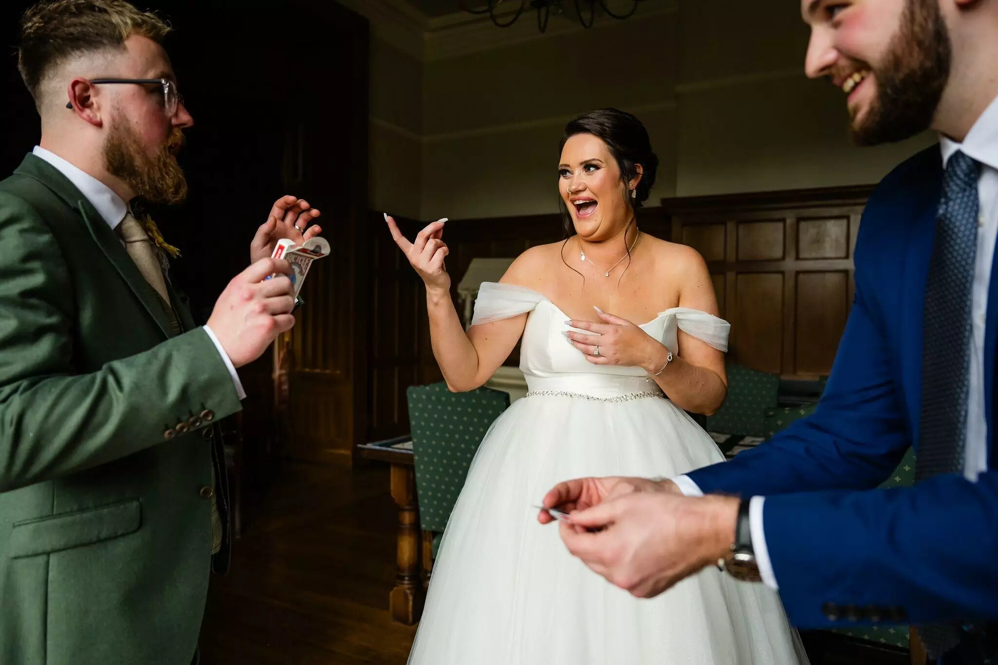 Wedding magician with bride and groom