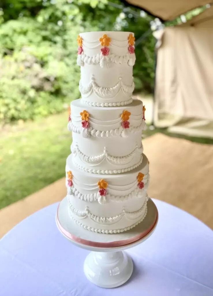 3-tier wedding cake with pink and orange buttercream - designed by Cakes of Curiosity