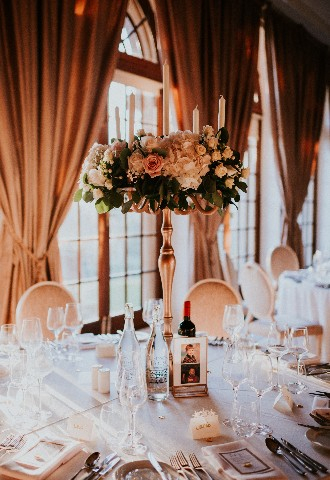 Candle flower display at wedding breakfast at Hedsor House Buckinghamshire