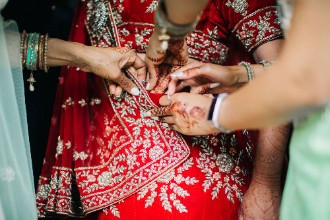 Brides dress being put on