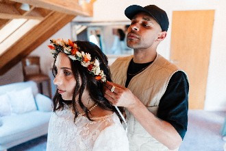 Bride with flower crown getting ready on wedding morning