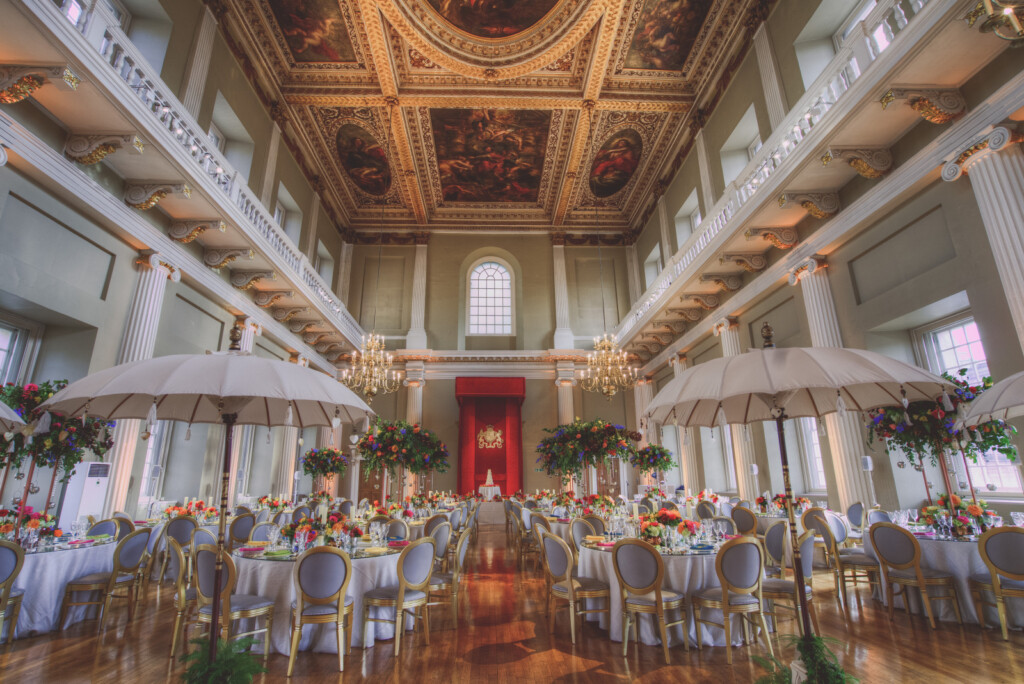 Wedding breakfast setting in the main hall of Banqueting House with tables beneath Sir Peter Paul Rubens famous ceiling paintings