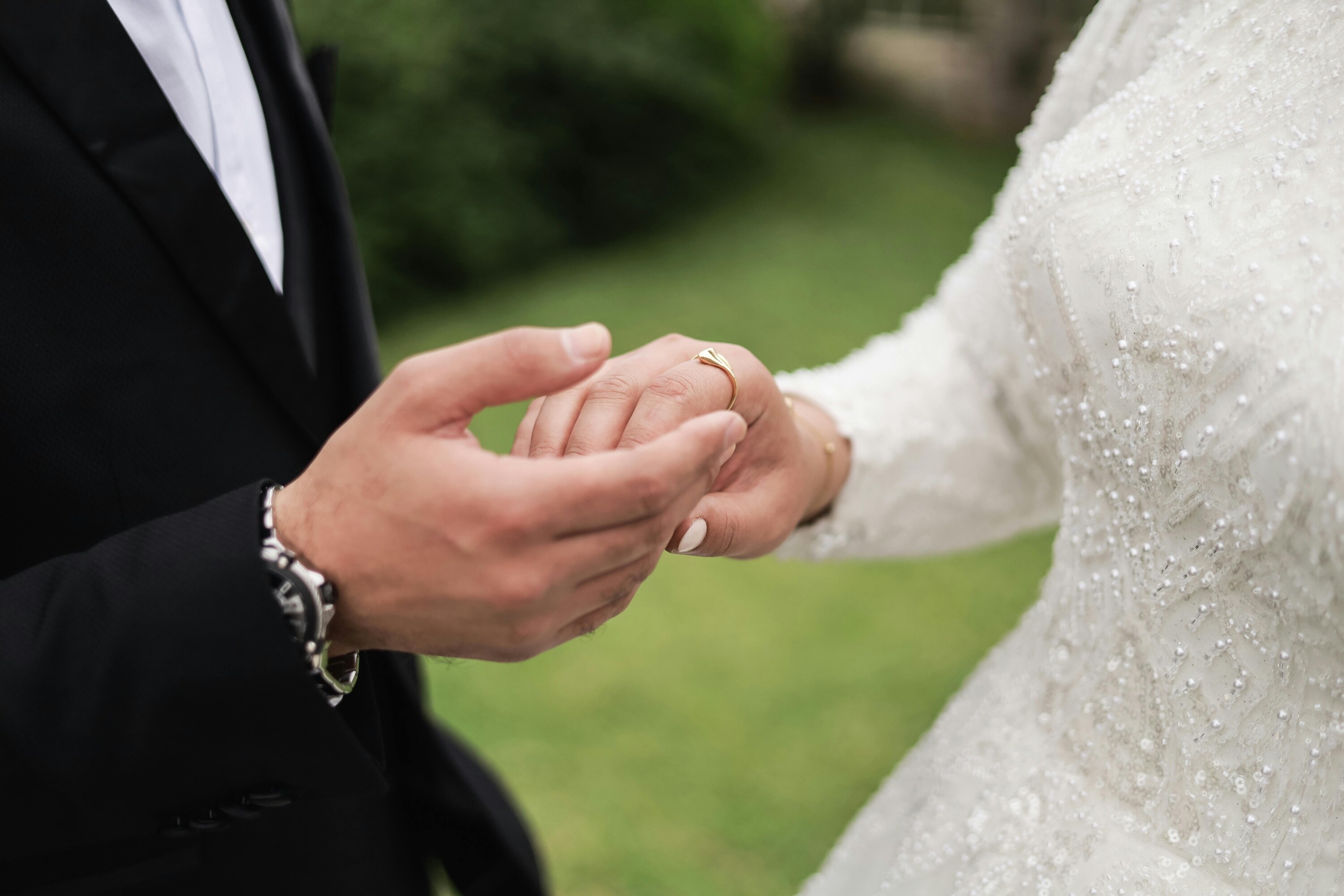 Close up of a bride and grooms hands on their wedding day
