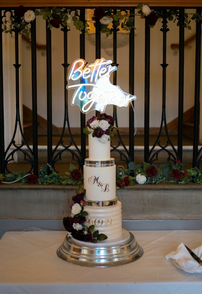 three tiered white wedding cake