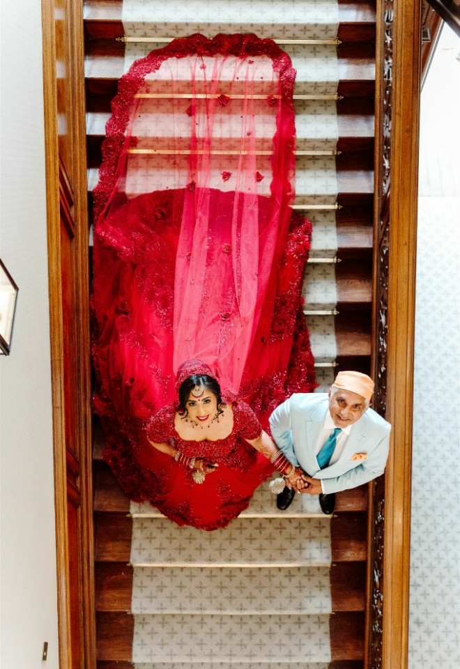 Brides beautiful dress and bride standing with the father