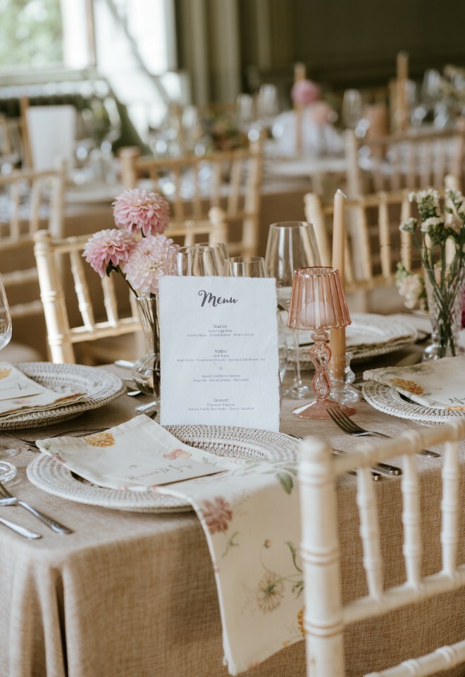 Close up of a wedding breakfast place setting with the menu