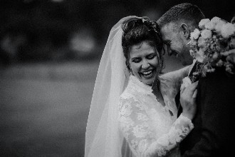 bride and groom laughing