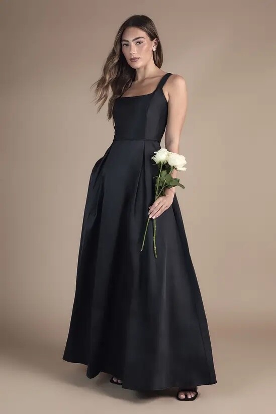 black scoop neck bridesmaid dress with wide straps and full skirt for black tie winter wedding