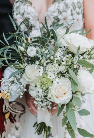 Close up of a white floral bouquet with green foliage from Go tell the bees