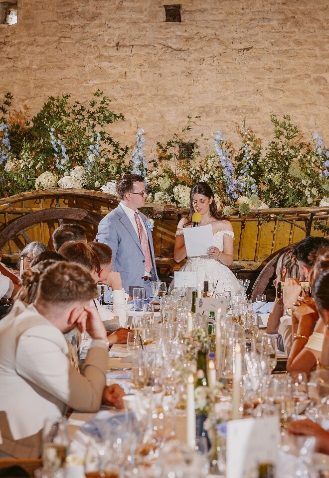 bride and groom give Speeches at their wedding reception at Cogges Manor Farm