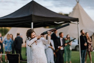 Bride clay pigeon shooting
