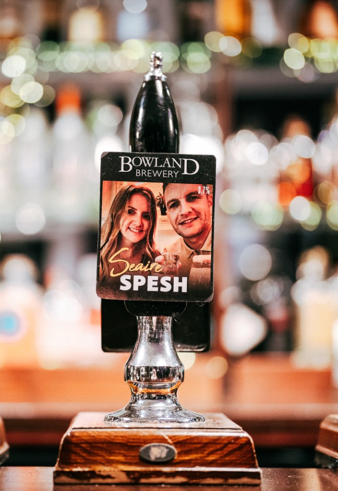 Personalised beer tap with the couples faces on it 