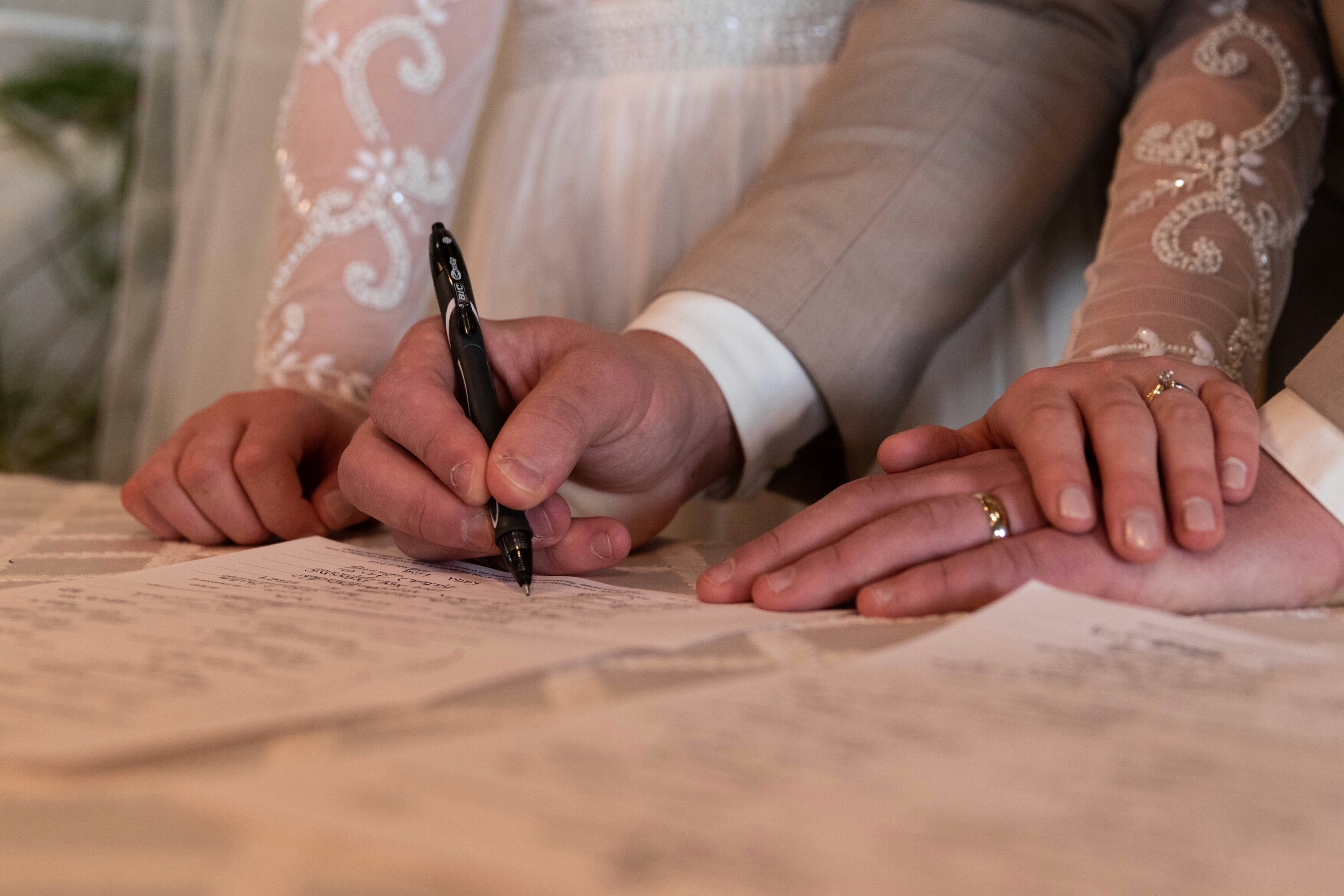 Married couple signing the register