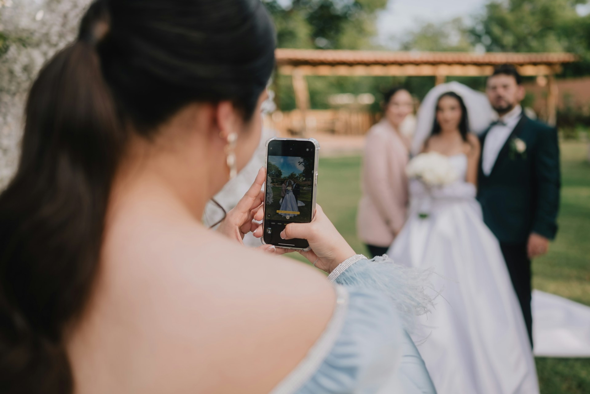 wedding content creator taking content of wedding couple
