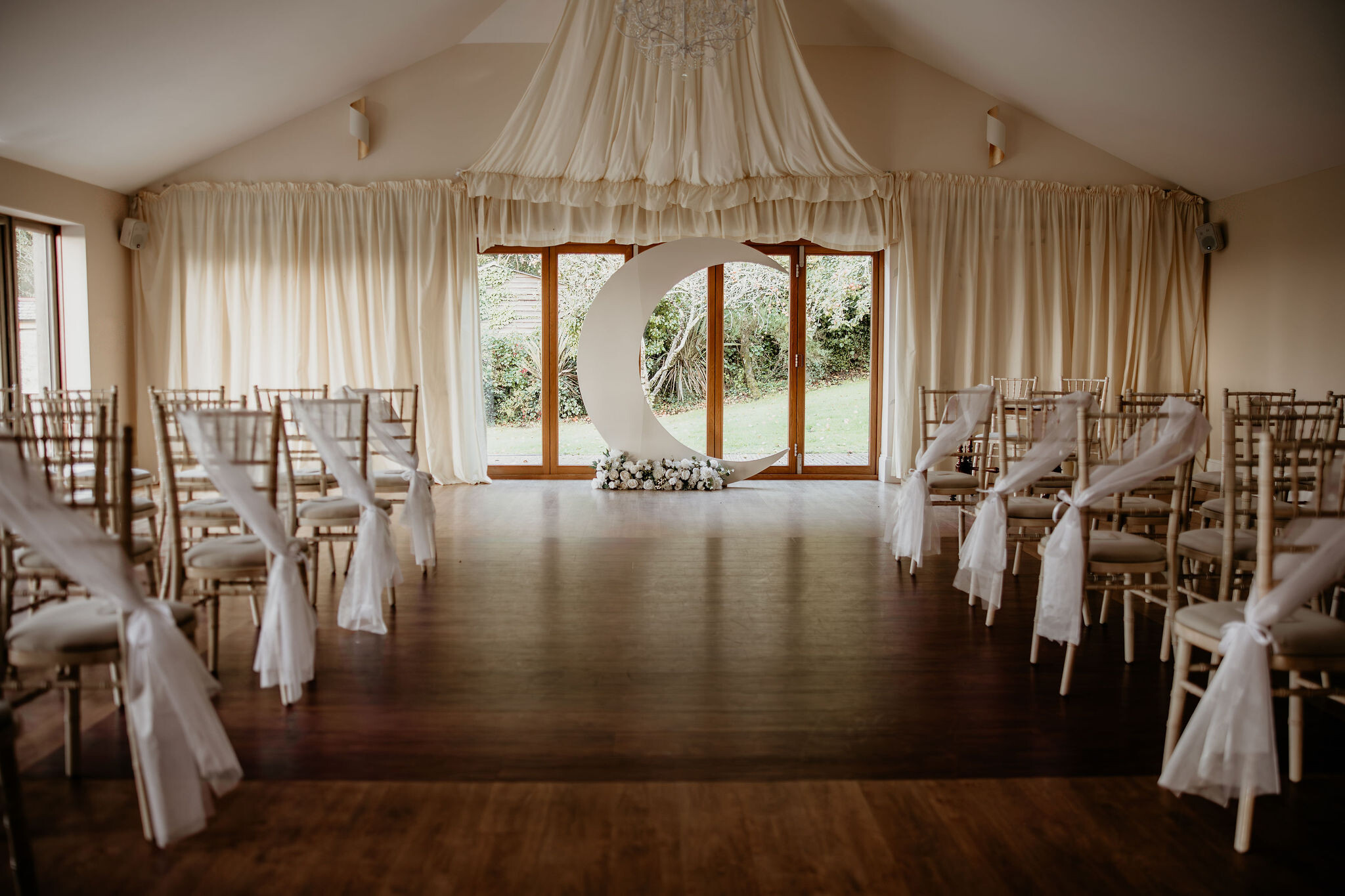 Ceremony Space at Tredudwell Manor in Cornwall, dressed in white with a celestial backdrop