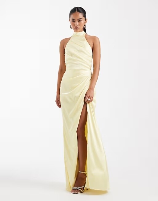 Butter yellow satin halterneck bridesmaid maxi dress for a spring wedding