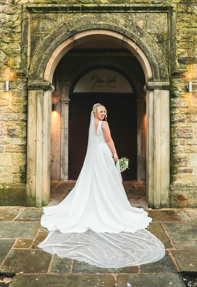 Bride outside of Mitton Hall