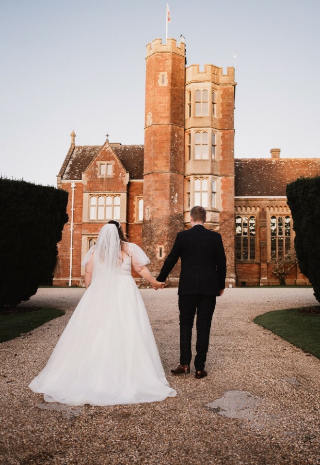 couple walking towards venue