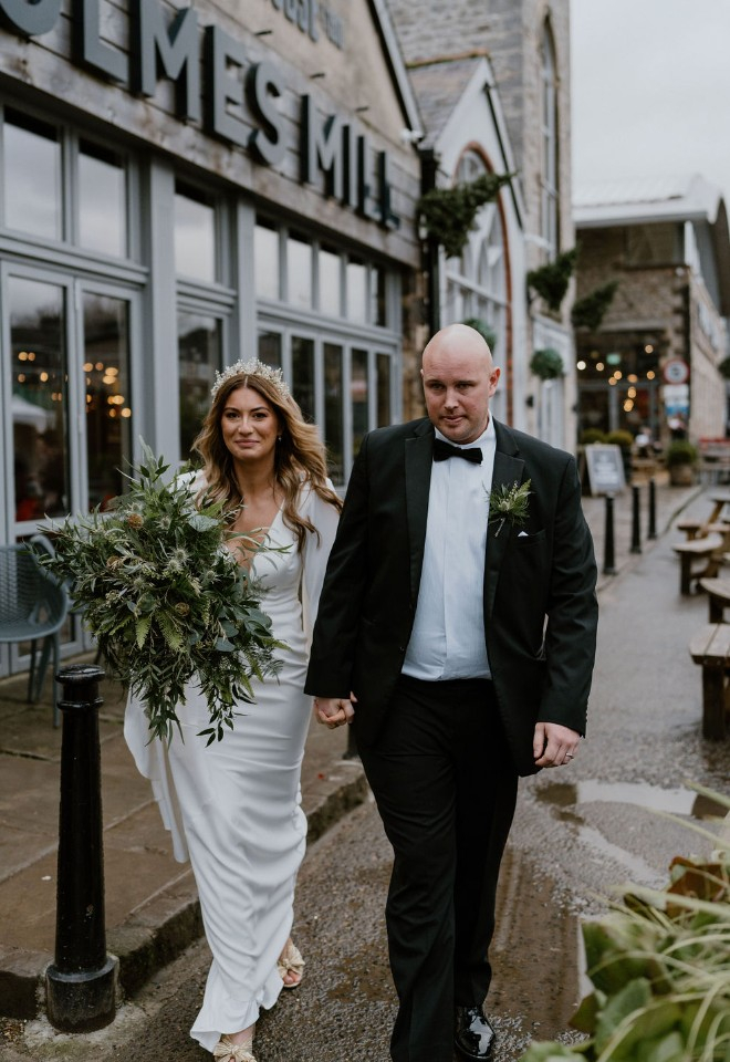 Bride and groom walking out of their ceremony