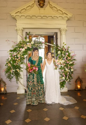 Ana and Satveer stood together at the end of the aisle