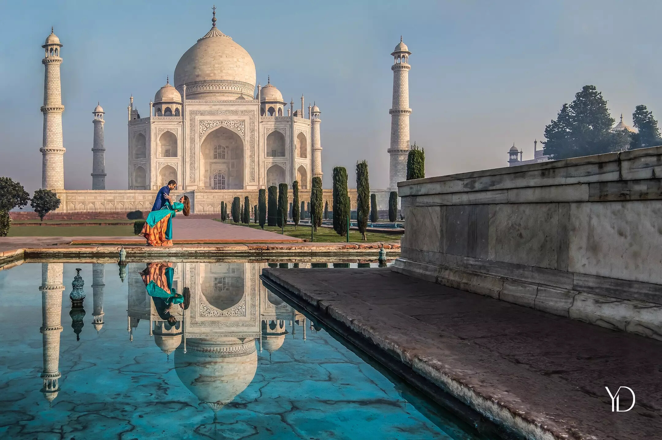 Wedding couple photo in front of the Taj Mahal in India. Taken by destination UK wedding photographer, Yellow Door Photography, Buckinghamshire 