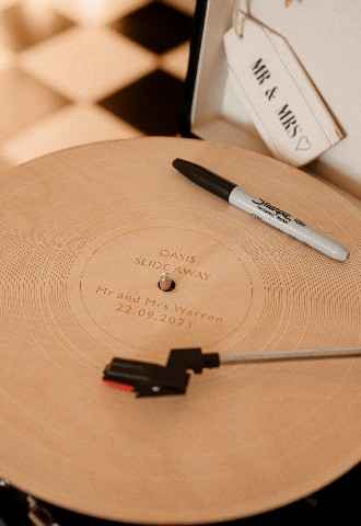Retro style record player with personalised first dance song at Southdowns Manor wedding venue