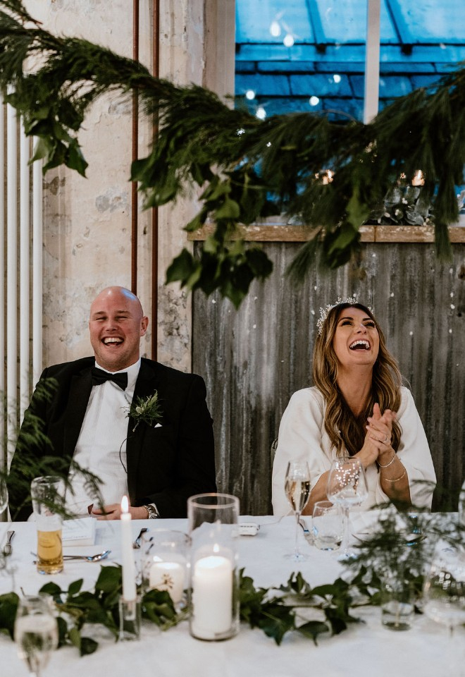 Bride and groom laughing 