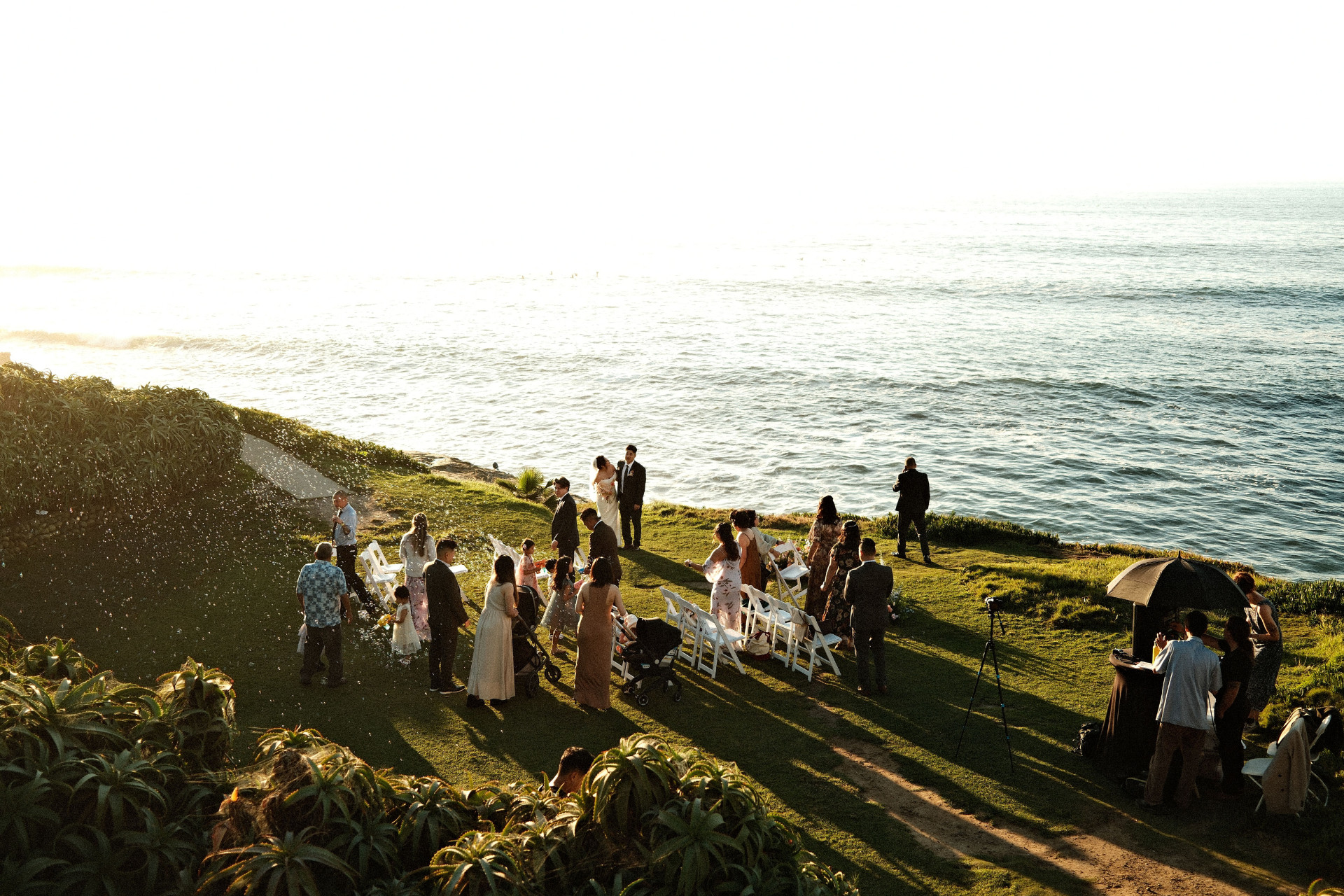 Wedding guests enjoying the beachside location