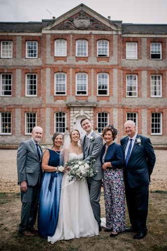 Bride and groom with parents outside Ardington House