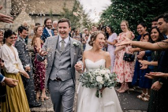 Bride and Groom showered with Confetti