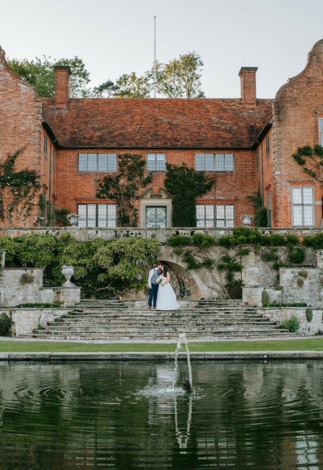 Bride and groom in the gardens of Port Lympne