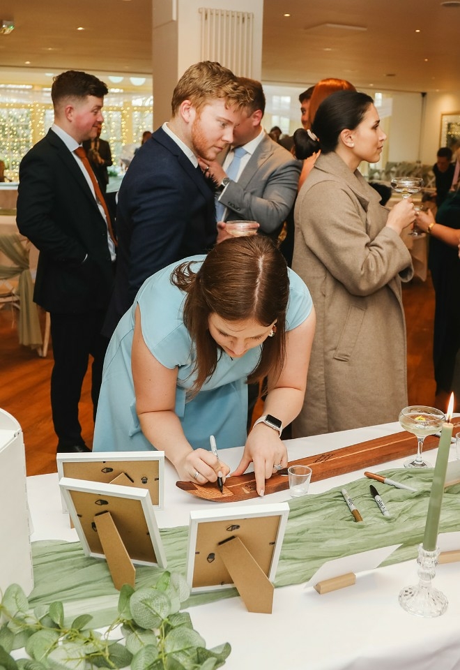 Guest signing ski board at Mitton Hall