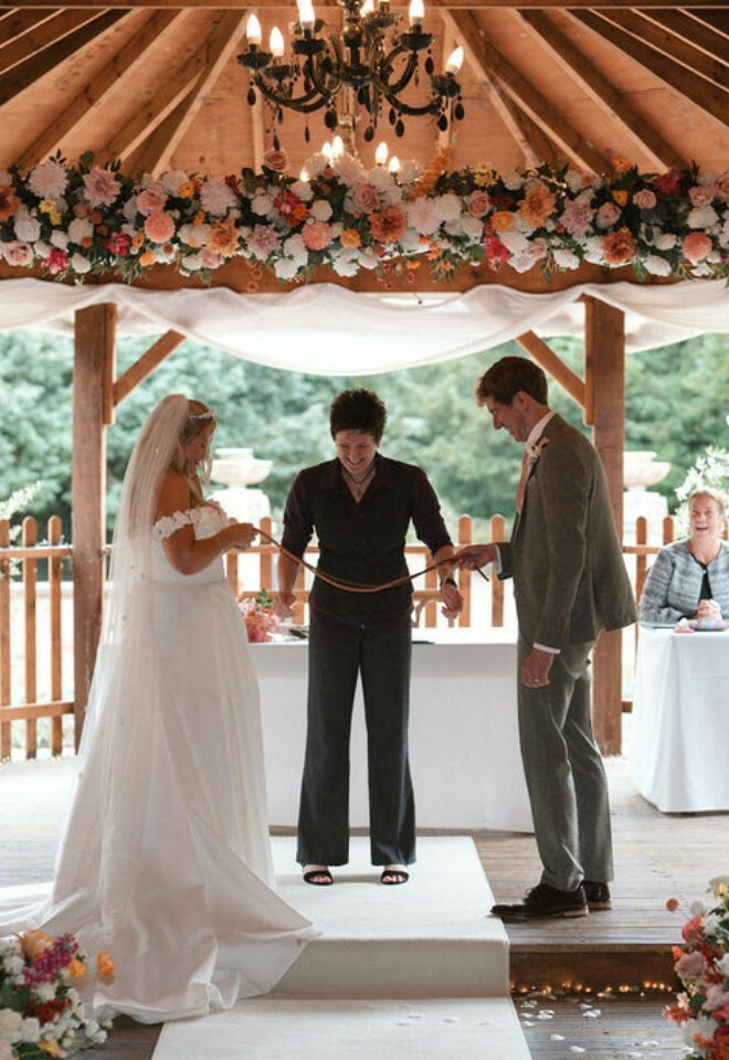 Handfasting ceremony takes place during wedding at Elmhay Park in Somerset