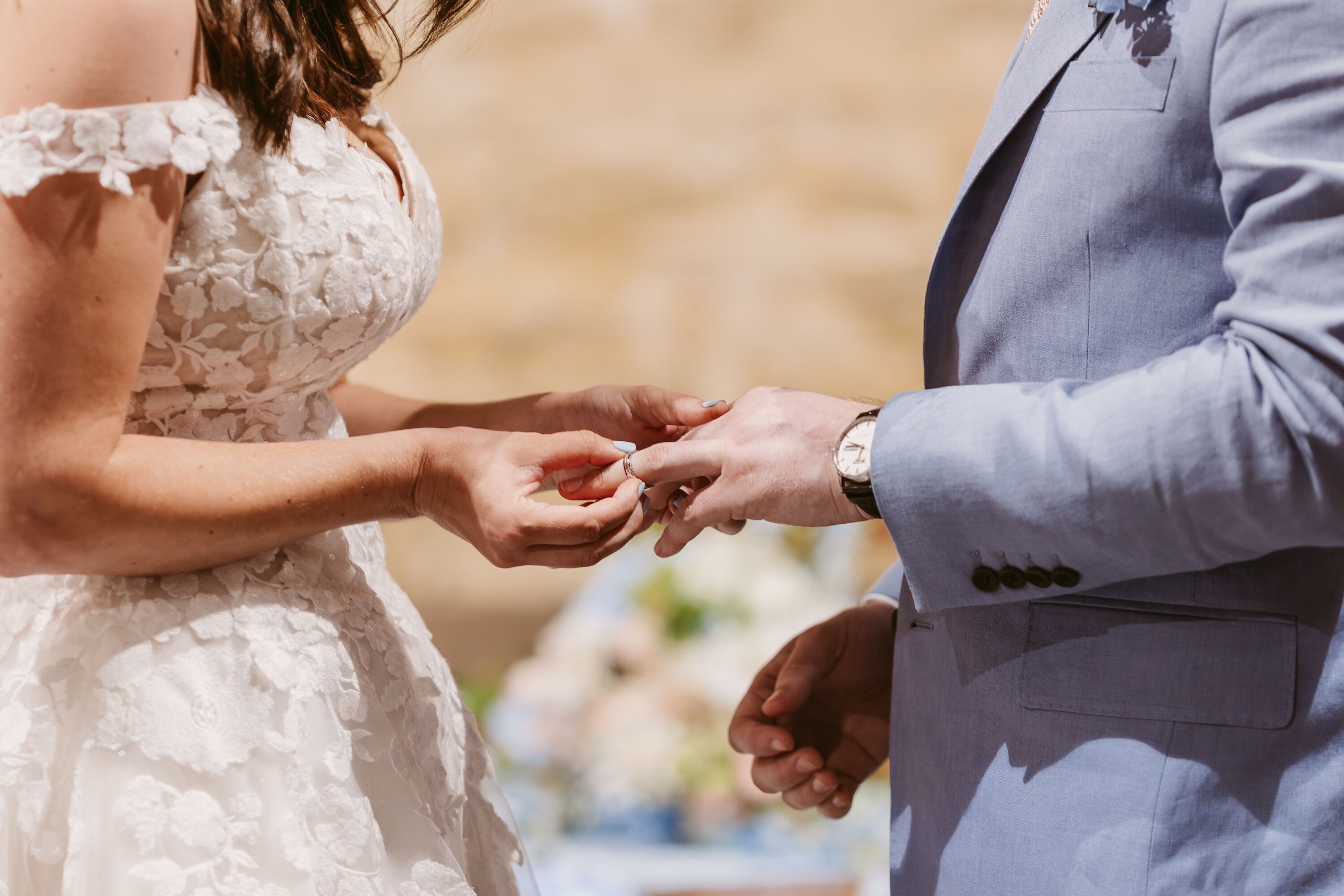 Ring exchange with bride and groom during wedding ceremony at Cogges Manor Farm 