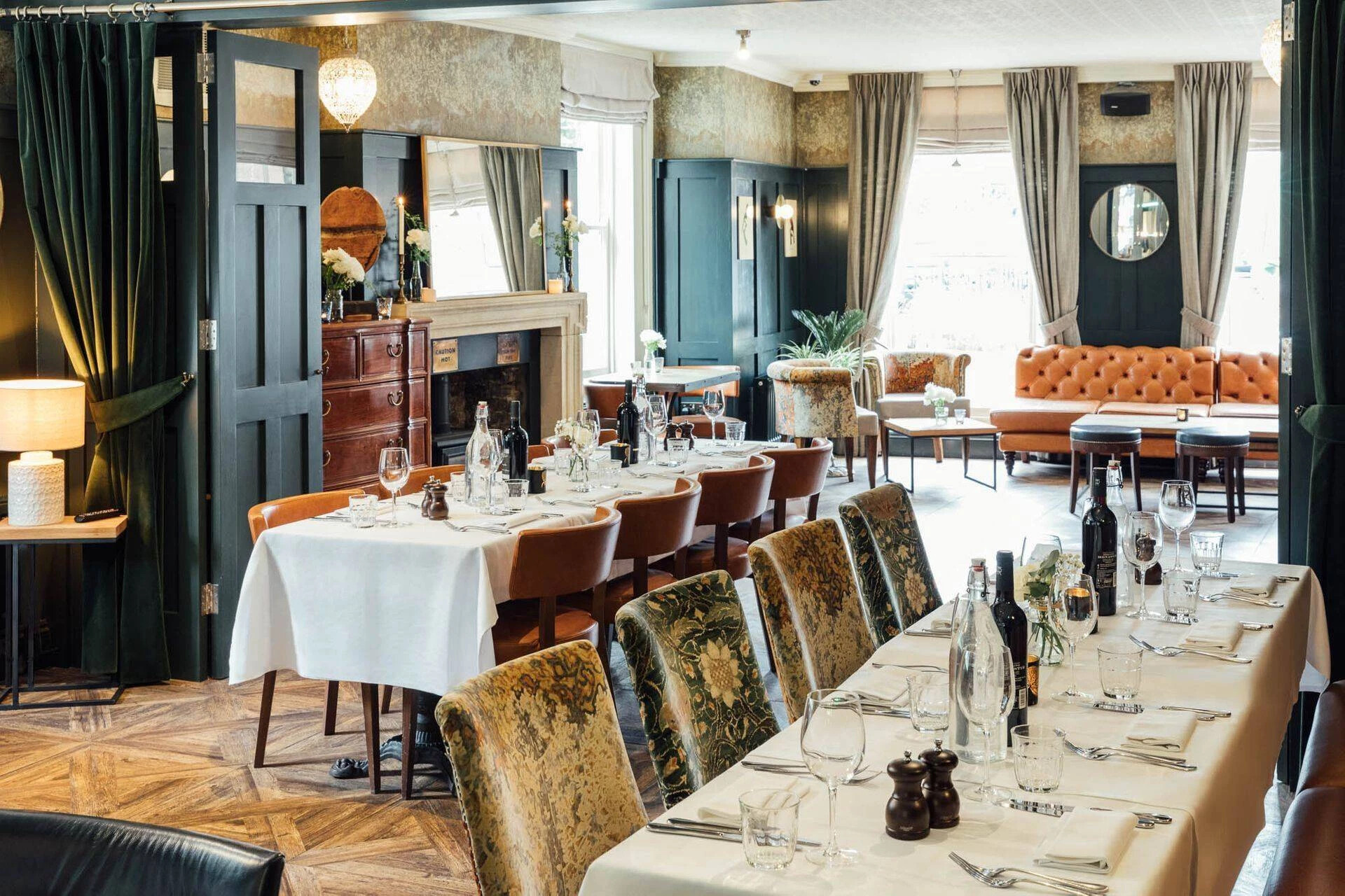 Dining tables set up in a private dining space at Banyers House, Hertfordshire.